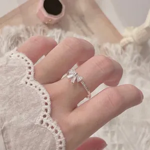 S925 sterling silver bow ring with sparkling zircons on a delicate jewelry box