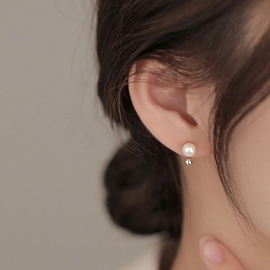 Minimalist S925 silver freshwater pearl stud earring worn on model for elegant look