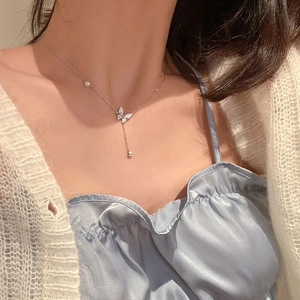 Elegant S925 sterling silver butterfly necklace with pearl accents and long tassel charms