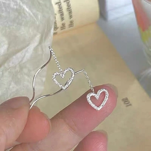 Elegant S925 silver hollow heart tassel earrings with sparkling white cubic zirconia stones