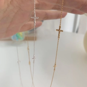 Detailed comparison of gold and silver S925 sterling silver cross pendants on O-chains