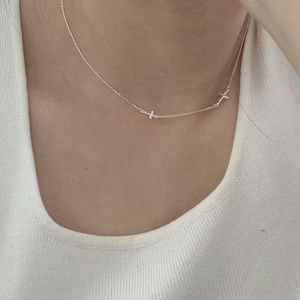 Elegant S925 sterling silver clavicle necklace with double cross pendants on female model