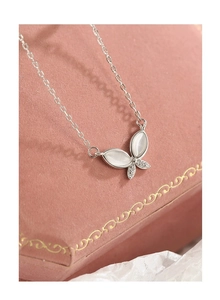 Close-up of S925 silver butterfly necklace with cat eye stone and cubic zirconia inlay