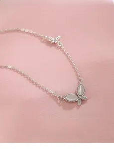 Close-up of S925 sterling silver butterfly necklace featuring cat eye stone and zircon wings