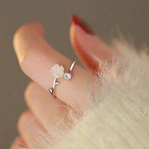 Close-up of S925 sterling silver camellia flower ring with shell rose and zircon inlay