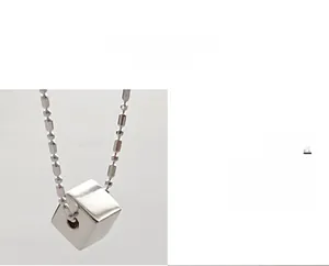 Detailed view of silver S925 cube pendant necklace with elegant beaded chain design