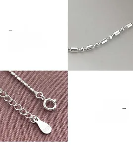 Macro shot of S925 sterling silver chain featuring spring clasp and hallmark tag