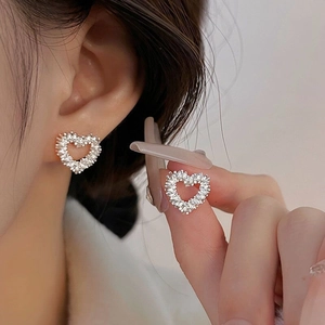 S925 sterling silver hollow heart stud earrings with sparkling silver texture for women
