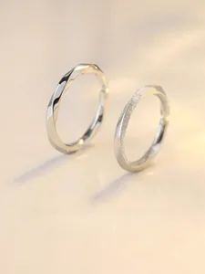 Detail of S925 sterling silver Mobius rings with twisted design and frosted finish