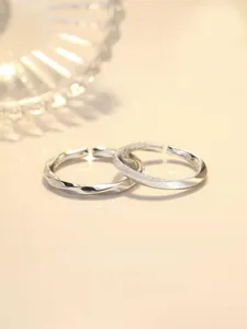 Detail of S925 silver Mobius rings showing polished and frosted textured finishes