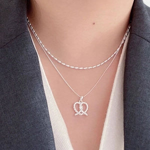 Minimalist S925 sterling silver twisted heart pendant necklace set worn by model