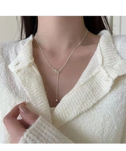 Detail of S925 sterling silver Y-shaped tassel necklace with minimalist bead pendant