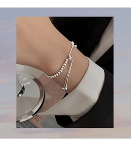 Close-up of S925 sterling silver bead bracelet with adjustable sliding toggle on a wrist