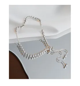 Detail of adjustable S925 sterling silver bead bracelet with sliding clasp and chain