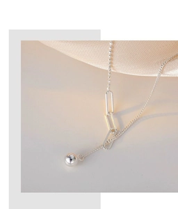 Detail of S925 sterling silver beaded chain with paperclip links and a polished ball charm