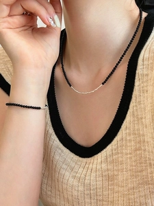 Detailed close-up of S925 sterling silver beads and black onyx stones on the wrist set