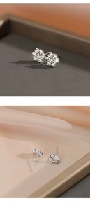 Macro view of S925 sterling silver flower stud earrings with sparkling cubic zirconia