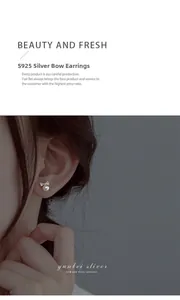Close-up of elegant S925 silver bow stud earrings with white pearls worn by a model