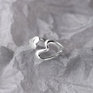 Detailed view of S925 silver open ring featuring double hollow heart shapes and mirror finish