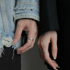 Minimalist S925 sterling silver couple rings with matte finish on model hand