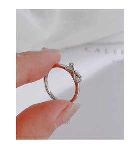Detailed close-up of a silver bow-shaped S925 sterling silver ring for women