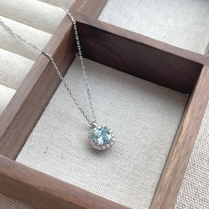 S925 silver necklace featuring a square sea blue zircon pendant in a halo diamond setting