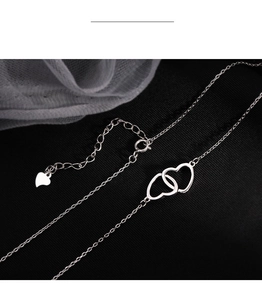 Detail of S925 sterling silver interlocking hearts pendant and adjustable lobster clasp