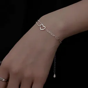 Minimalist S925 silver hollow heart bracelet with asymmetric chain design for women
