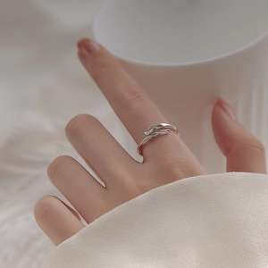 Detailed close-up showing the S925 silver hallmark on a minimalist Mobius ring