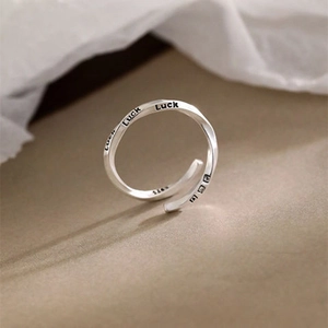 Macro shot of S925 sterling silver Mobius ring showing Luck engraving and S925 hallmark