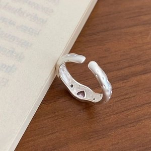 S925 sterling silver hammered open ring with purple heart gemstone on book background