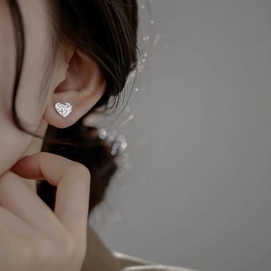 Elegant S925 sterling silver heart stud earrings with unique foil texture for women