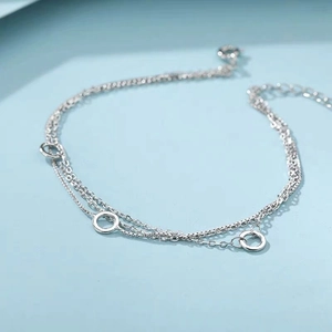 Elegant S925 sterling silver double-layer bracelet with circular pendants and lobster clasp