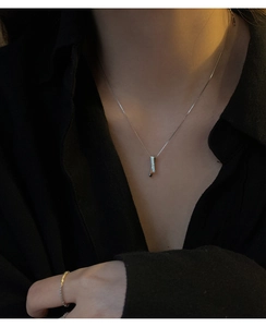 Close-up of S925 sterling silver rectangular pendant necklace with sparkling pavé zircons