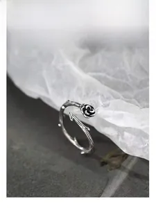 Macro detail of S925 silver thorn rose ring showing vine textures and floral design