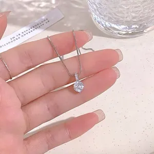 Macro shot of S925 sterling silver solitaire pendant necklace with box chain