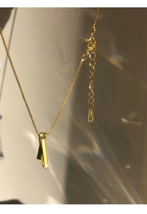 Detail view of S925 sterling silver gold necklace with interlocking geometric bars
