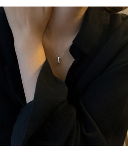Close-up of S925 sterling silver long bar pendant necklace with sparkling micro-pave zircons