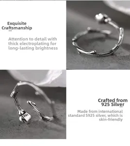 Macro detail of S925 sterling silver thorn and rosebud ring with textured branch design