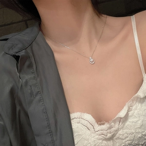 Elegant S925 sterling silver moon and star necklace worn by a model as a clavicle chain