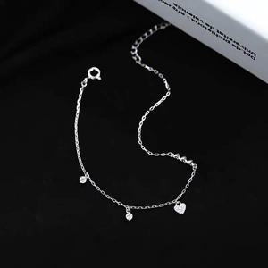 Elegant S925 silver heart bracelet with sparkling crystals on minimalist black background