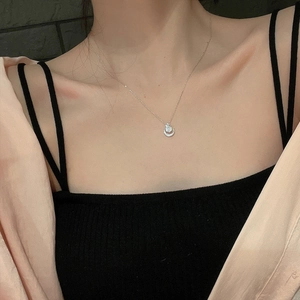 Elegant S925 sterling silver crescent moon necklace with round stone on a female neck
