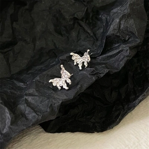 Detailed close-up of S925 silver stud earrings with irregular lava texture design
