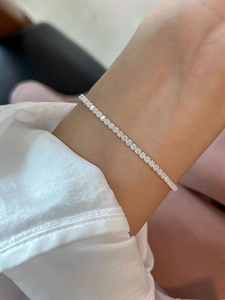 Close-up of elegant S925 sterling silver tennis bracelet with cubic zirconia on wrist