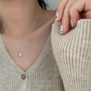 Close-up of S925 sterling silver irregular meteorite necklace on model collarbone