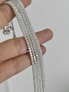 Close-up of five S925 sterling silver tennis bracelets with shiny cubic zirconia stones