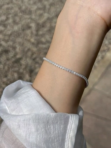 Elegant S925 sterling silver tennis bracelet with sparkling zircons on a female wrist