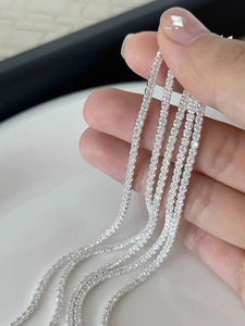 Macro detail of S925 sterling silver tennis bracelets with sparkling prong-set zircon stones