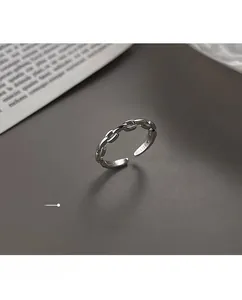 Macro detail of S925 sterling silver chain ring showing the metal hallmark and minimalist link design