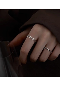 Close-up of minimalist S925 sterling silver chain ring worn on index finger